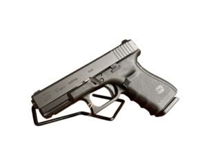 Używany pistolet Glock 19 Gen 4 w kalibrze 9x19 mm z zamontowanym klipsem do paska.